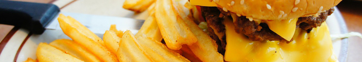 Eating Burger Mediterranean Sandwich Pub Food at East Village Grille restaurant in Asheville, NC.